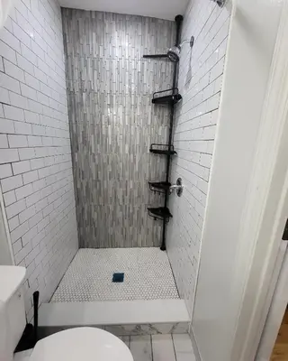 a bathroom with a shower with a toilet at OoohLaLa! 2 Beds and 2 Full Baths w/Free Parking in Newark