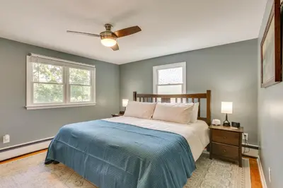 a bedroom with a bed and a ceiling fan at Charming Highland Falls Home Less Than 2 Mi to West Point! in Highland Falls