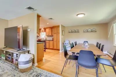 a dining room and kitchen with a table and chairs at Charming Highland Falls Home Less Than 2 Mi to West Point! in Highland Falls