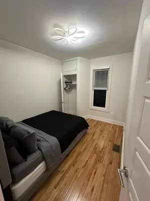 a bedroom with a bed and a ceiling fan at Modern & Spacious 3 BED & 2 BA Condo mins from NYC in Jersey City