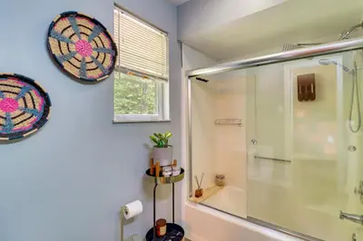a bathroom with a shower and a glass shower stall at Long Pond Home with Hot Tub about 8 Mi to Kalahari! in Long Pond