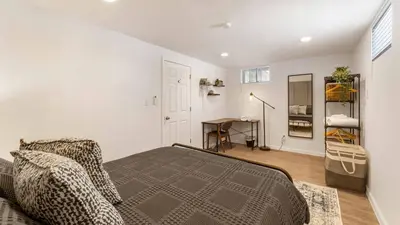 a bedroom with a bed and a desk in it at Birchwood by AvantStay Game Room Lake Access in Blakeslee