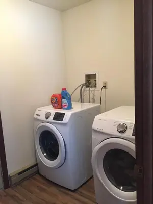 a washing machine and a washer in a room at Ash Cottage in Poconos near Camelback & Kalahari in Long Pond