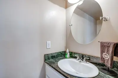 a bathroom with a sink and a mirror at Walk to Mall and Train Station! Philly Suburb Stay in Willow Grove