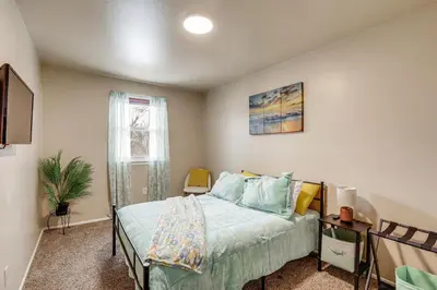 a bedroom with a bed and a window at Walk to Mall and Train Station! Philly Suburb Stay in Willow Grove