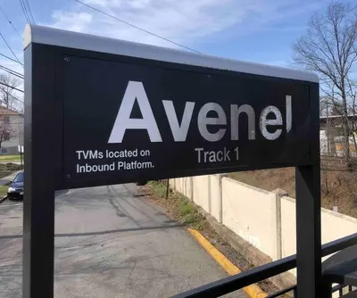 a sign for a sign for a car dealership at Private 2-bedroom house, free parking, 15-min walk to direct NYC Manhattan train, MetLife Stadium FIFA World Cup 30 minutes away in Edgar