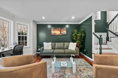 a living room with green walls and a couch at Spacious 6 BR Villa - Serene Scenic Mountain Escape in Bloomingburg