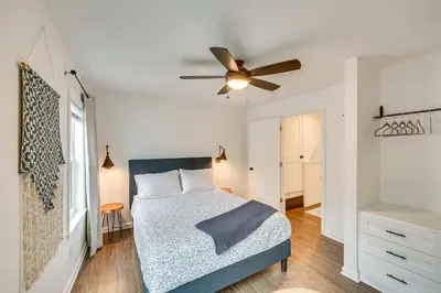 a bedroom with a bed and a ceiling fan at Chic Lancaster Vacation Rental, Walkable Location! in Lancaster