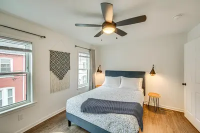a bedroom with a bed and a ceiling fan at Chic Lancaster Vacation Rental, Walkable Location! in Lancaster