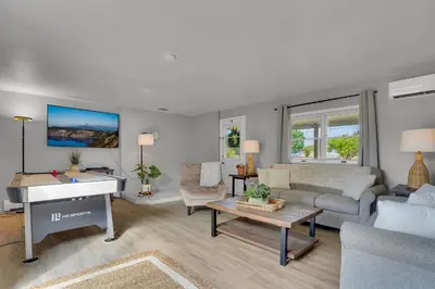 a living room with a couch and a piano at Nature Haven Pond,Pool and Hot Tub in Myerstown