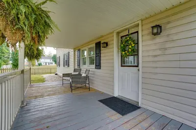 a front porch of a house with a wreath on the door at Nature Haven Pond,Pool and Hot Tub in Myerstown
