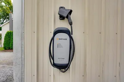 a solar phone attached to the side of a building at Nature Haven Pond,Pool and Hot Tub in Myerstown