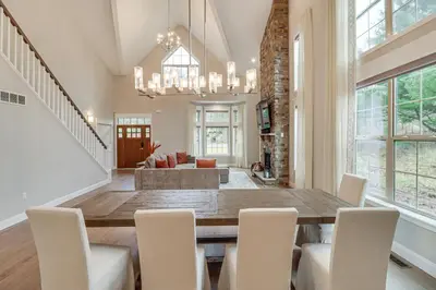a dining room with a large table and chairs at BBQ-Ready Deck Lake Harmony Home with Fire Pit in Lake Harmony