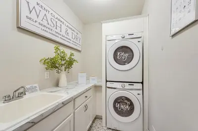 a white laundry room with a washer and dryer at BBQ-Ready Deck Lake Harmony Home with Fire Pit in Lake Harmony