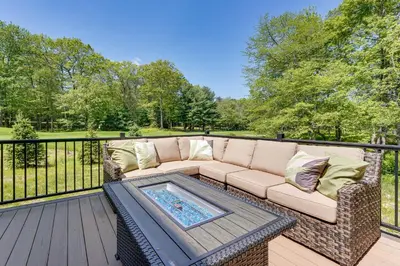 a couch on a deck with a table at BBQ-Ready Deck Lake Harmony Home with Fire Pit in Lake Harmony
