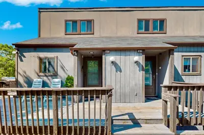 a house with a porch and a deck at Mountain Home at Camelback in Tannersville