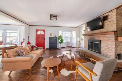 a living room with a couch and a fireplace at Serene Catskills Retreat with Deck in Woodbourne