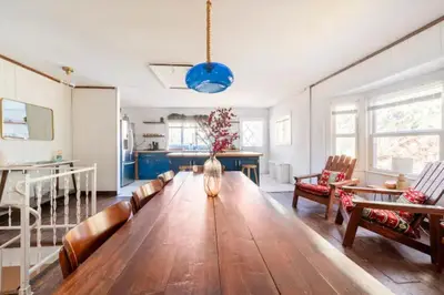 a large living room with a long wooden table at Serene Catskills Retreat with Deck in Woodbourne