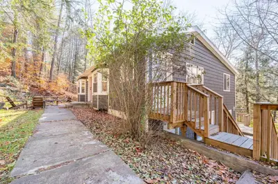 a tiny house with a porch and a deck at Serene Catskills Retreat with Deck in Woodbourne