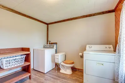 a laundry room with a washer and dryer at Wellsboro Farmhouse with Grill and Fire Pit! in Wellsboro