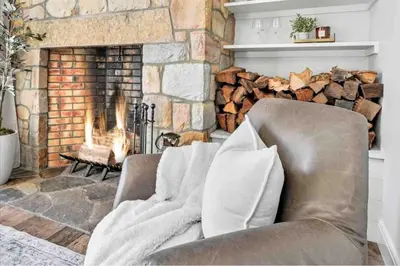 a living room with a couch and a fireplace at The Roundtop Chalet romantic couples getaway in Wrightsville