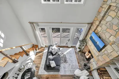 an overhead view of a living room with a stone wall at The Roundtop Chalet romantic couples getaway in Wrightsville