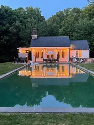 a house with a pool in front of a house at Pool Cottage at Roundtop Estate couples oasis in Wrightsville
