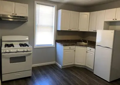 a kitchen with white appliances and a white refrigerator at Private 2-bedroom apartment, free parking, direct bus to NYC Manhattan only 2 blocks away, MetLife Stadium FIFA World Cup 25 minutes away in Linden