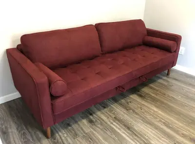 a brown leather couch sitting in a room at Private 2-bedroom apartment, free parking, direct bus to NYC Manhattan only 2 blocks away, MetLife Stadium FIFA World Cup 25 minutes away in Linden