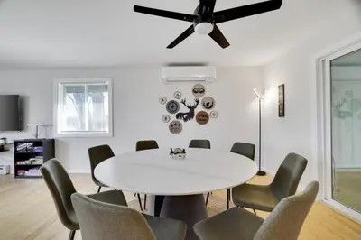a dining room with a white table and chairs at (NEW) Blue Mtn Poconos Retreat Htd pool pet frndly in Effort