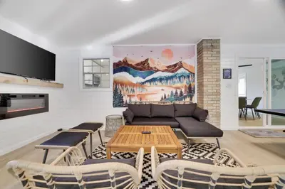 a living room with a couch and a table at (NEW) Blue Mtn Poconos Retreat Htd pool pet frndly in Effort