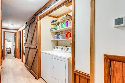 a laundry room with a washer and dryer at Creek Access and Deck Family Pocono Pines Cottage in Pocono Pines