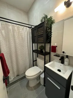 a bathroom with a toilet and a sink at Columbus House in New York