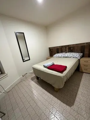 a bedroom with a bed with a mirror on the wall at Hudson Yard 408 in New York