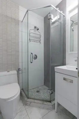 a bathroom with a shower and a toilet and a sink at Park South Central 3 Bedroom with Private Terrace in New York