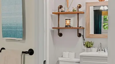 a bathroom with a sink and a mirror and a toilet at Walk to the Lake Firepit and Sunroom Tomhickon in Arrowhead Lake