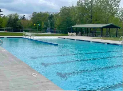 a large blue swimming pool with a gazebo at Rustic Poconos Ranch w Game Room in Tobyhanna
