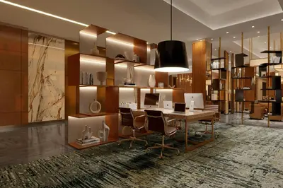 a living room with a table and chairs and a library at AC Hotel by Marriott Newtown Square in Newtown Square