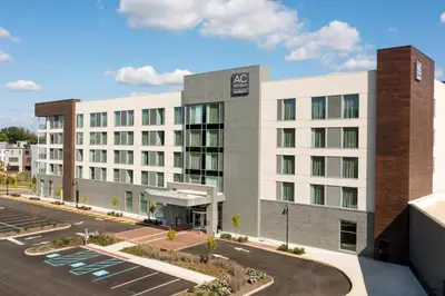 a rendering of an mgm hotel with a parking lot at AC Hotel by Marriott Newtown Square in Newtown Square