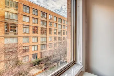 a window with a view of a building at Chelsea 1br w roofdeck gym nr Flatiron NYC-1384 in New York