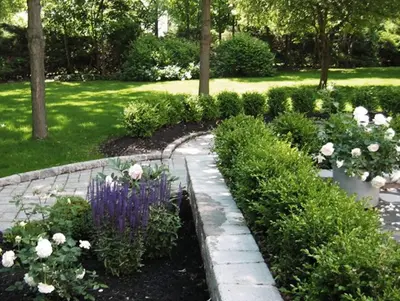 a garden with flowers and a stone path at private luxe, garden, wellness home steps from Princeton in Franklin Park