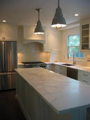a kitchen with white cabinets and a marble counter top at private luxe, garden, wellness home steps from Princeton in Franklin Park