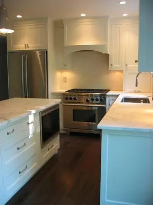 a kitchen with white cabinets and stainless steel appliances at private luxe, garden, wellness home steps from Princeton in Franklin Park