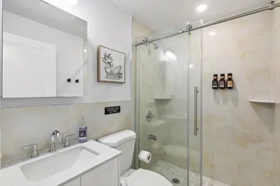a bathroom with a shower and a toilet and a sink at Stay at Luna at Convention Center in Philadelphia