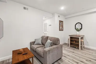 a living room with a couch and a table at Stay at Luna at Convention Center in Philadelphia