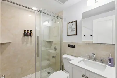 a bathroom with a shower and a toilet and a sink at Stay at Luna at Convention Center in Philadelphia