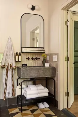 a bathroom with a sink and a mirror at Hotel Anna & Bel in Philadelphia