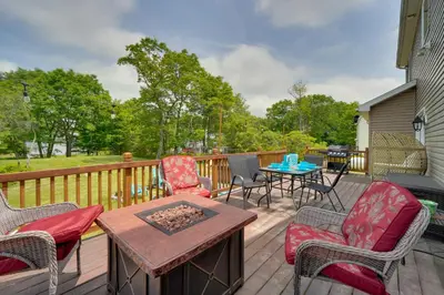 a deck with chairs and a table and a table at 1 Mi to Lakes Family Pocono Home with Yard and Deck! in Long Pond
