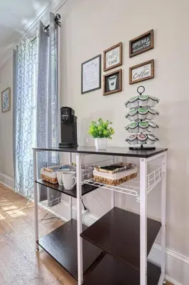 a white shelf with dishes on it in a room at The Farm House in Dillsburg