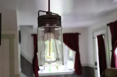 a mason jar light hanging from a ceiling at Penn's Creek Symphony in Spring Mills